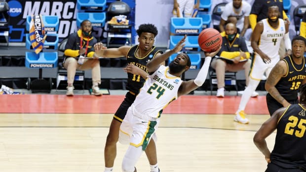 Mar 18, 2021; Bloomington, Indiana, USA; Norfolk State Spartans guard Jalen Hawkins (24) shoots in front oof Appalachian State Mountaineers guard Donovan Gregory (11) during the second half in the First Four of the 2021 NCAA Tournament at Simon Skjodt Assembly Hall. Mandatory Credit: Trevor Ruszkowski-USA TODAY Sports